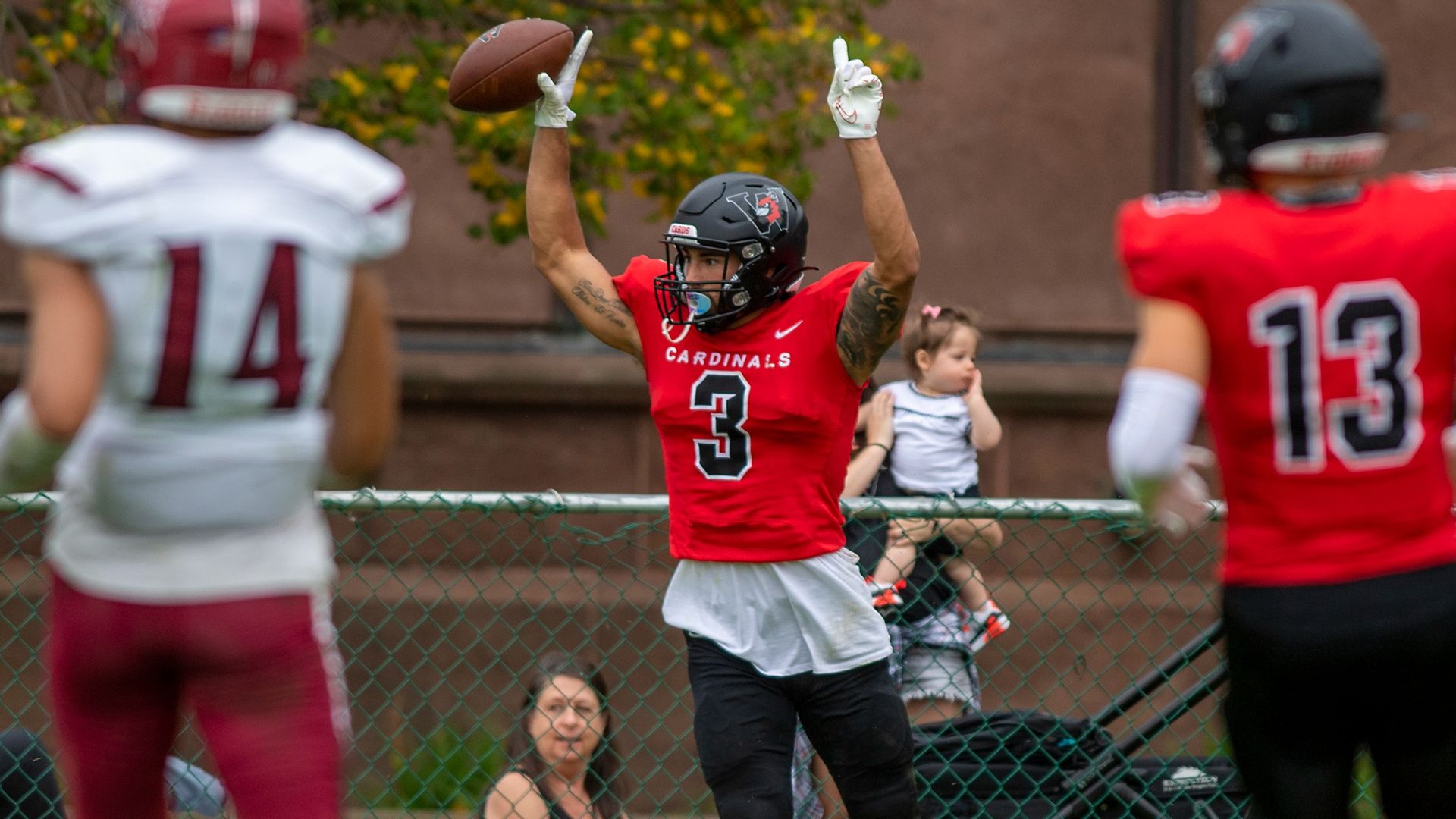 Logan Tomlinson celebrates one of his two touchdowns in a definitive season opening win.